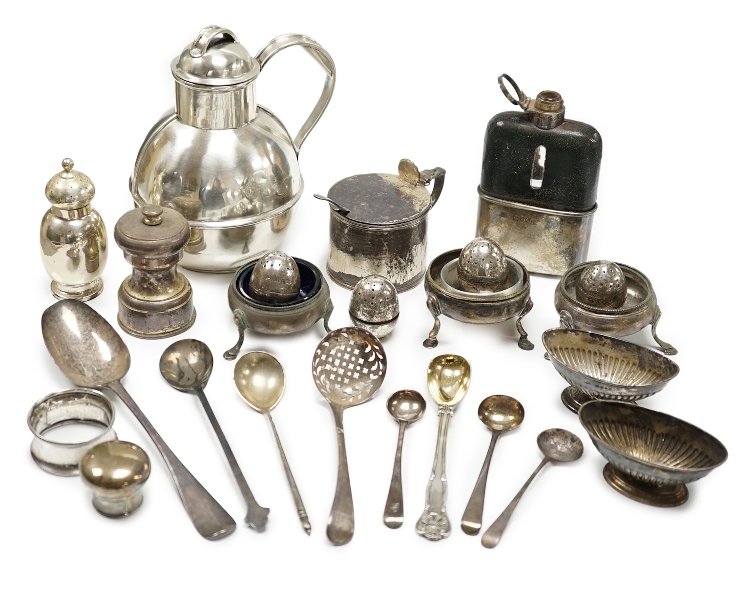 Sundry small silver including a Guernsey can milk jug, mustard pot, damaged mounted glass hip flask, flatware and minor plated wares.